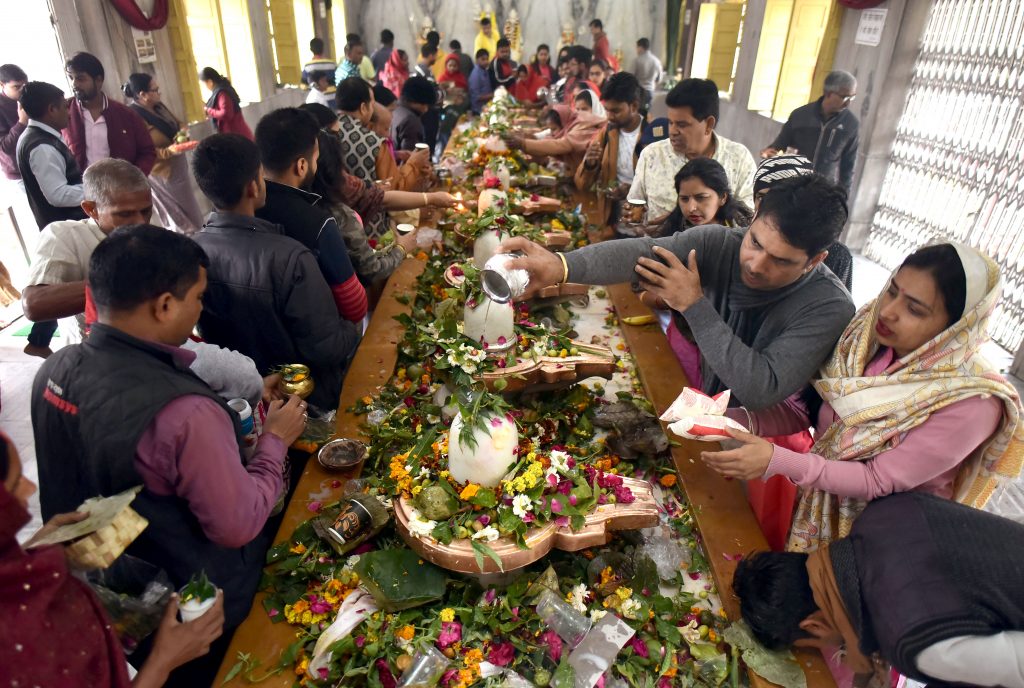 Devotees perform rituals on the occasion of Maha Shivratri