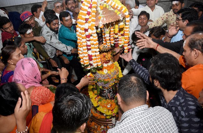 Devotees performing rituals to 'Shivling'
