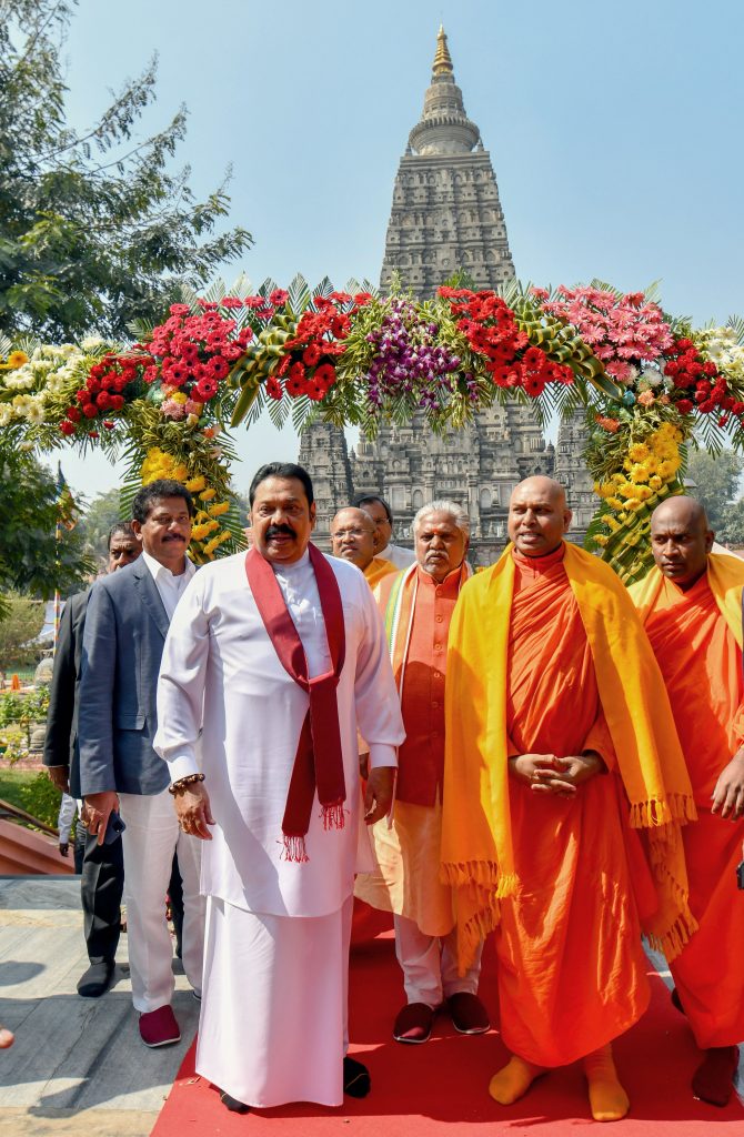 Sri Lankan Prime Minister Mahinda Rajapaksa pose for a photograph during his visit to world heritage Mahabodhi Temple