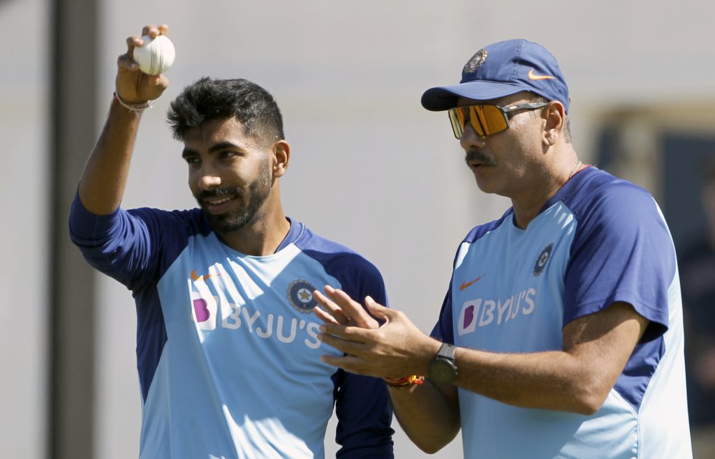 Indian pacer Jasprit Bumrah and Head Coach Ravi Shastri (L) during a practice session