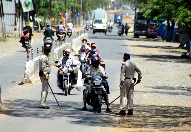 Security personnel stops commuters