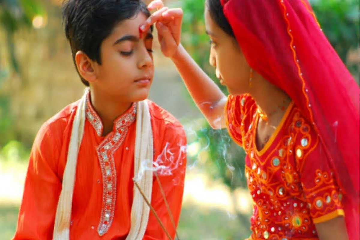 Bhai Dooj 2022: भाई दूज पर बहनें भाइयों को क्यों देती हैं गाली?, जानिए इस प्रथा के पीछे की कहानी