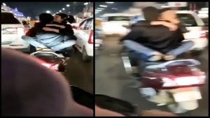 Viral Video: चलती स्कूटी पर रोमांस करते कपल का वीडियो हुआ वायरल, भड़के लोग